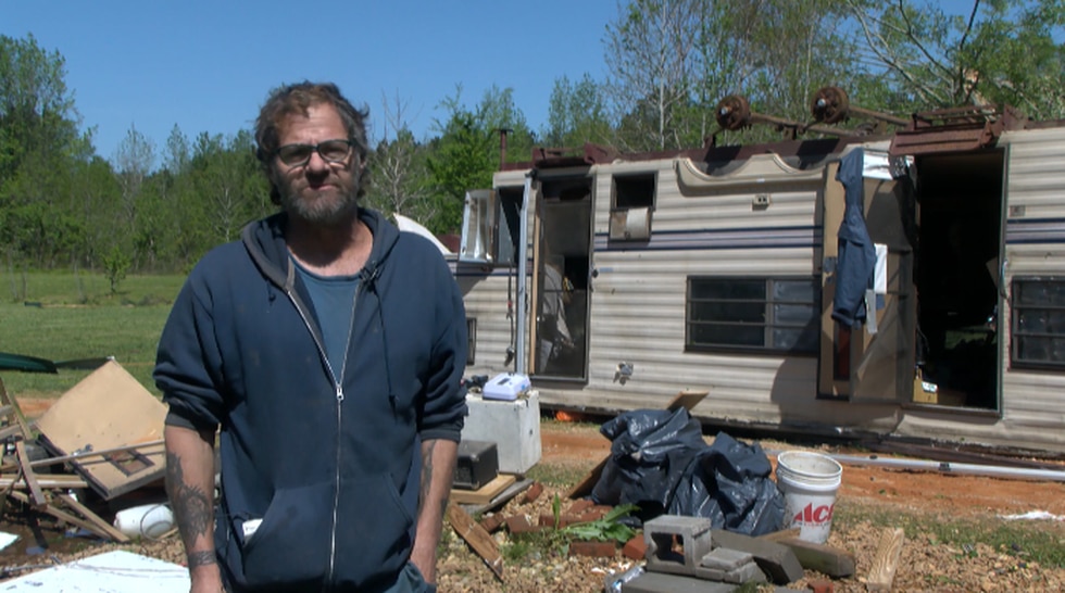 Scott County man rides out storm in camper while clinging to his pit bull