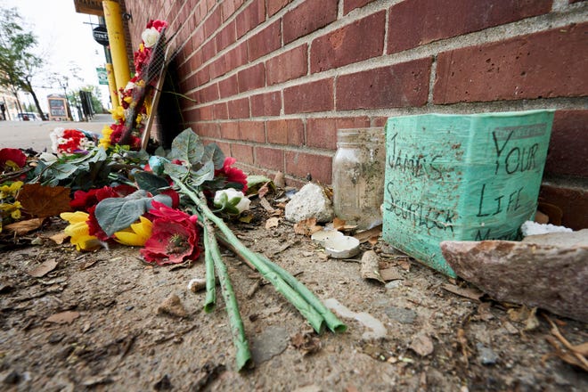 A memorial for James Scurlock remains Wednesday near where he was shot and killed May 30, in Omaha, Neb. A federal judge has thrown out a lawsuit filed by the family of a white Nebraska bar owner who killed himself after being charged in the fatal shooting of Scurlock, a Black man, during 2020 protests over racial injustice.