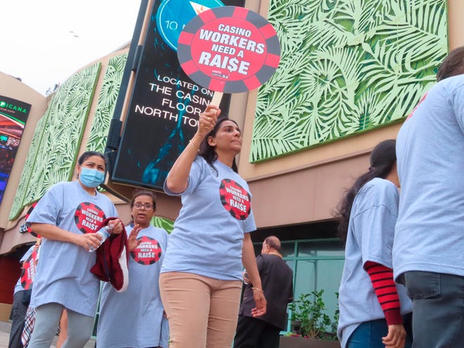 Members of Atlantic City’s main casino workers union picket outside the Tropicana casino Wednesday, the day after Local 54 of the Unite Here union’s contracts expired with the Jersey shore city’s nine casinos. The union is seeking what it terms “substantial” wage increases in a new contract, arguing that as the casinos recover financially from the coronavirus pandemic, so too should their workers.