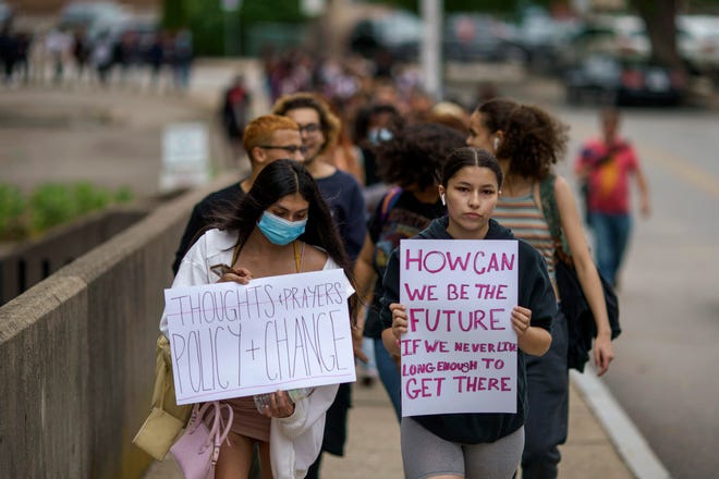 Students from Shea High School walk out at lunch to protest the nation’s gun policies Wednesday in Pawtucket, R.I.