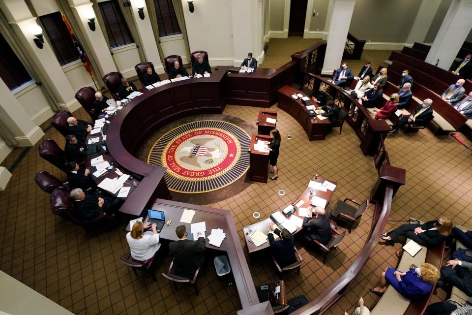 Attorney Kaytie Pickett, at the well, argues before the Mississippi Supreme Court, Wednesday, April 14, 2021, in Jackson, on behalf of Madison Mayor Mary Hawkins-Butler's lawsuit challenging a medical marijuana initiative by saying because Mississippi's initiative process is outdated and the issue should not have been on the ballot because of the way signatures were gathered. Voters approved the medical marijuana initiative in November 2020.